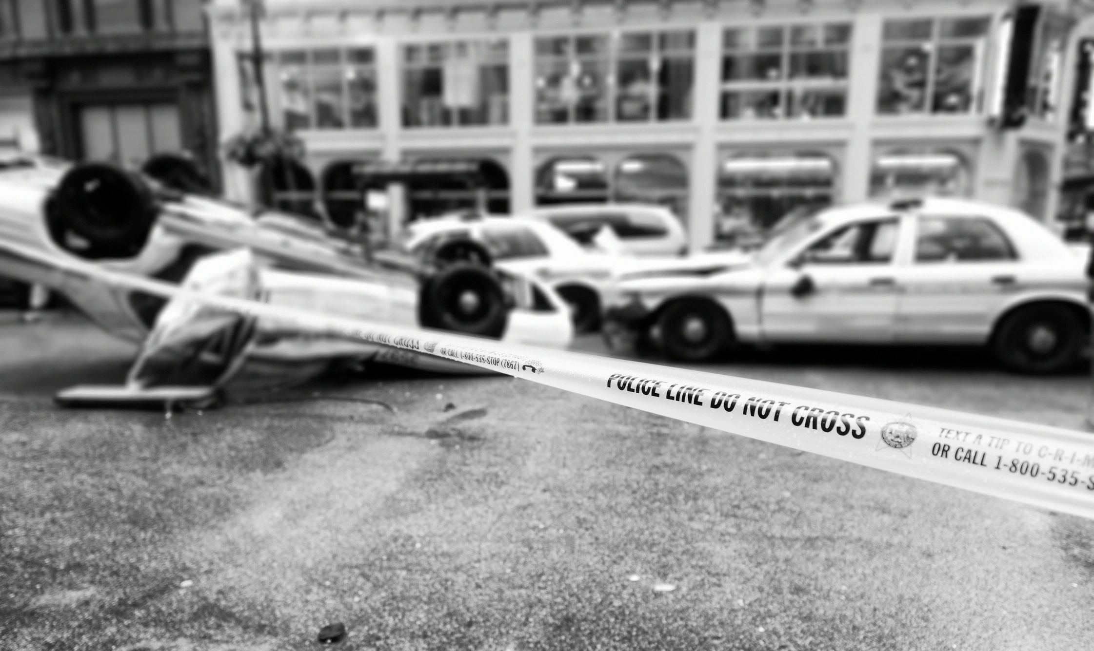 Police tape at a city intersection